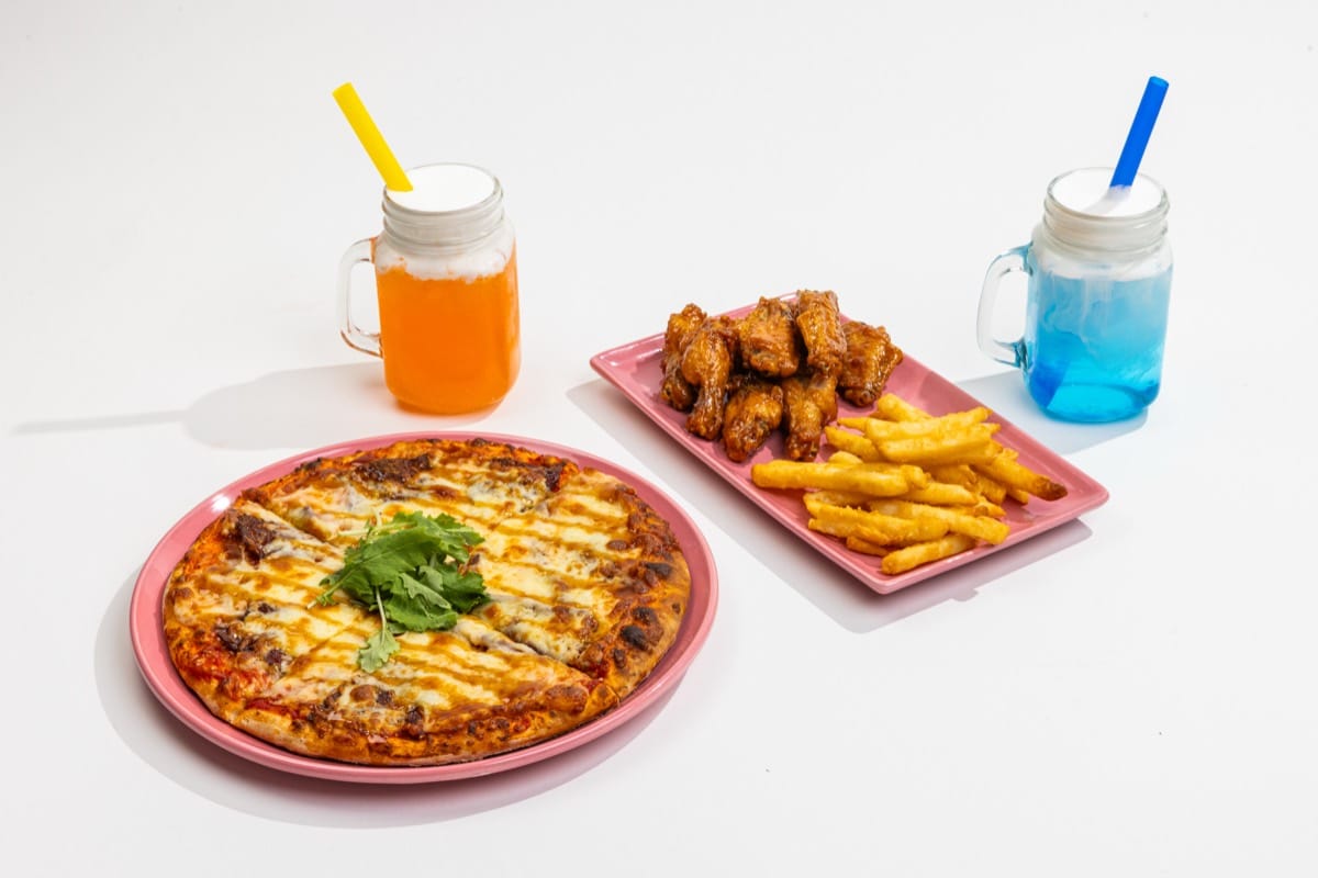 Combo 1: pizza, chicken wings with fries, and two dirty sodas