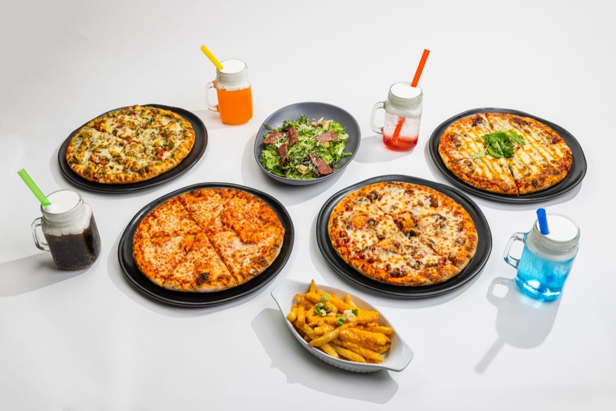 Combo 2: four pizzas, cheesy fries, Caesar salad and four dirty sodas